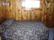 The second bedroom in Cabin #15 has a double bed.