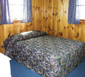 The first bedroom in Cabin #17 has a double bed.