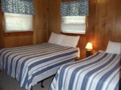 The second bedroom in Cabin #2 has two double beds.