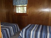 The third bedroom in Cabin #2 has a double bed and a twin bed.